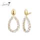 Oorclips met heldere strass steentjes en goudkleurige top